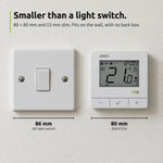 ENGO E4i white thermostat beside a UK light switch: 80 mm against 86 mm