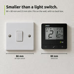 ENGO E4i black thermostat beside a UK light switch: 80 mm against 86 mm